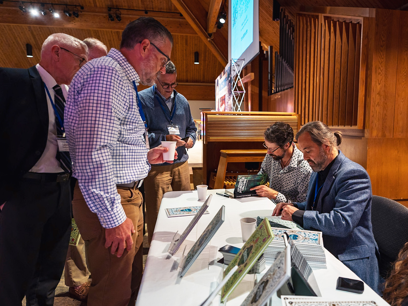 Attendees browse the conference bookstore before the opening session.
