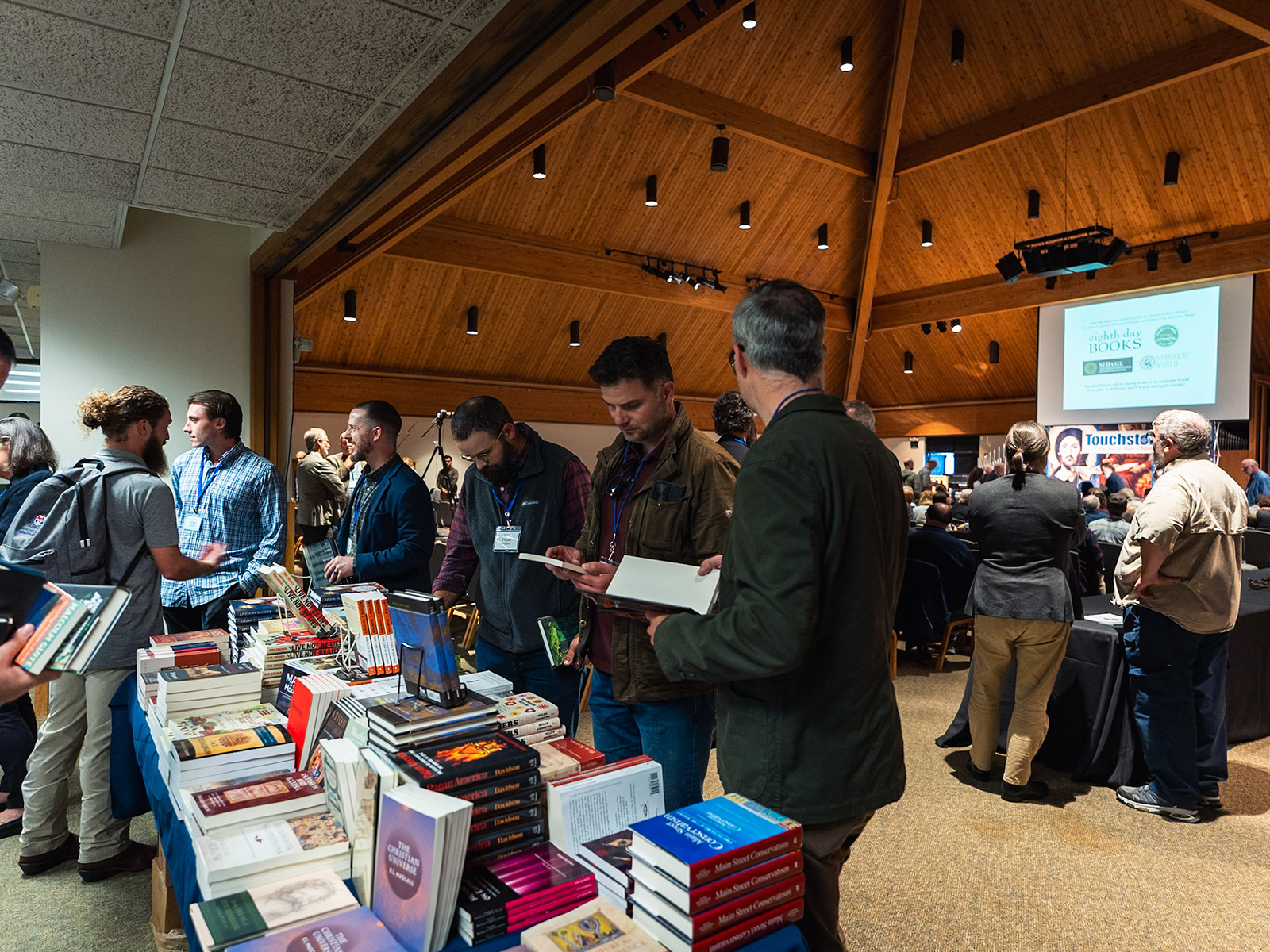 Attendees browse the conference bookstore before the opening session.